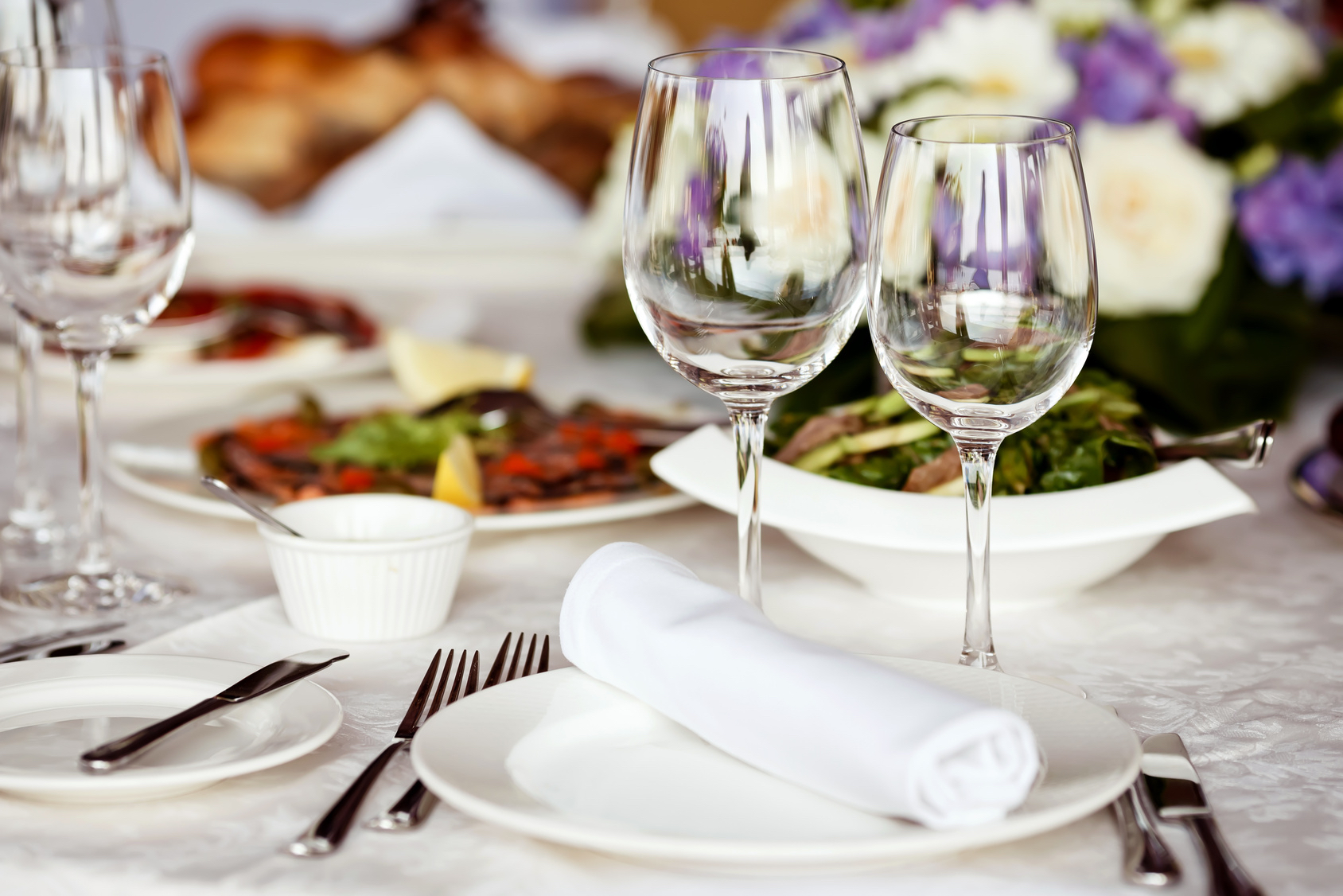 Empty glasses set in restaurant Brooksby Hall